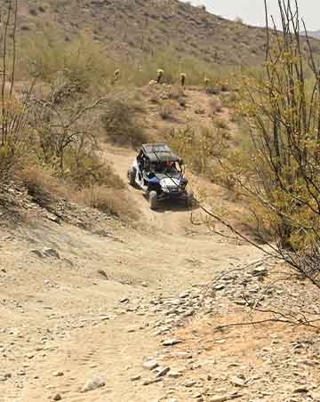Off-highway vehicle on a trail